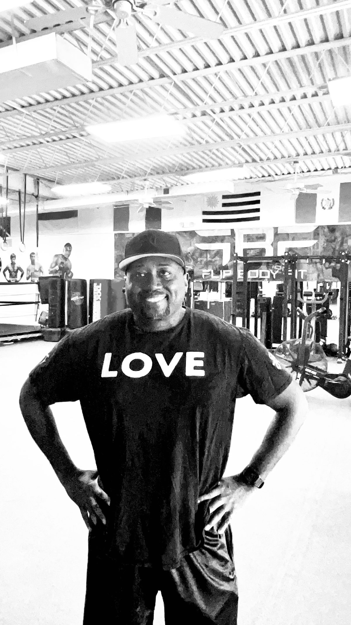 Coach Sean Archer smiling in a gym